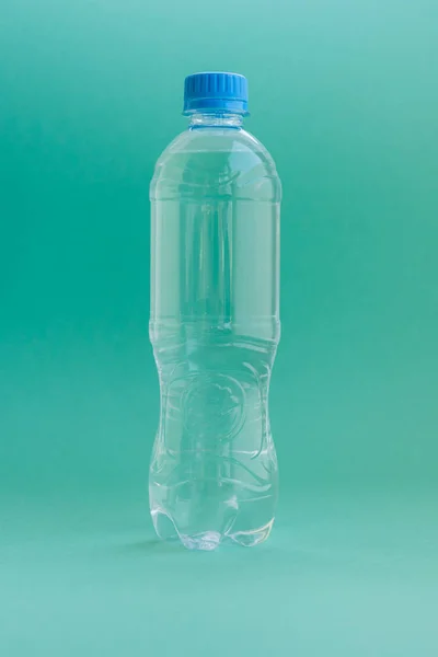 Transparent Plastic Bottle Filled Clean Water Uniform Mint Color Background — Stock Photo, Image