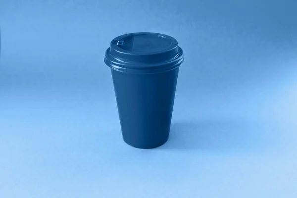 Paper blue glass on a blue background. Classic blue color of the year 2020 — Stock Photo, Image