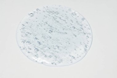 Beyaz bir zemin üzerinde hyaluron damlaları Sıvı dolu oksijen