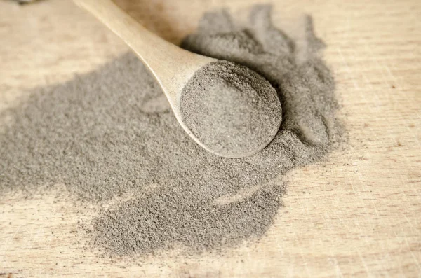 stock image wooden spoon with flour on the table