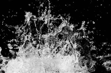 Water splash isolated on natural background.Close up view of aqua foam and air bubbles