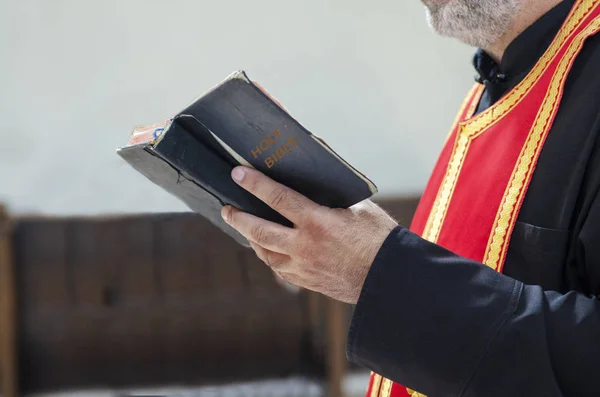 Close Priest Holding Bible Hands — Stock Photo, Image