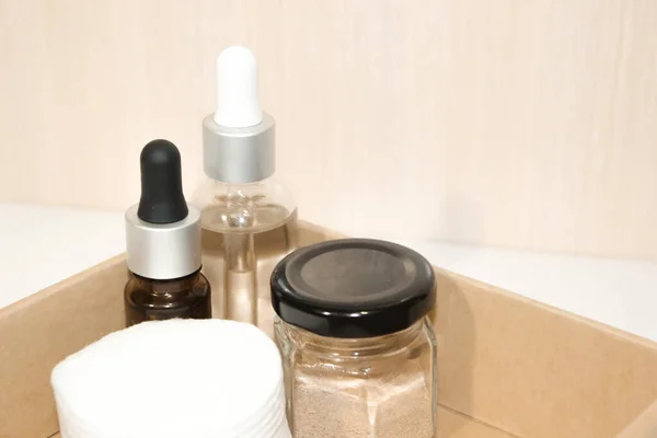 Cosmetic clay in glass containers for skin care. Cosmetic containers for creams or gels.