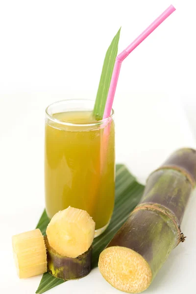 Fresh sugar cane juice in glass on white background — Stock Photo, Image