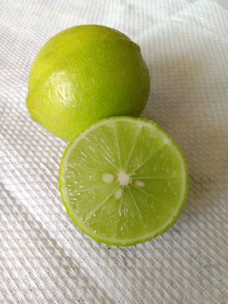 Fresh half cut light yellow lemon and white background — Stock Photo, Image