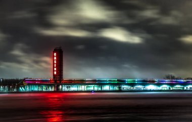 Sarnia, Ontario, Canada - April 9 2015: Illuminated neon sign and exterior of the Point Edward Casino in the waterfront district of Sarnia, Ontario. clipart