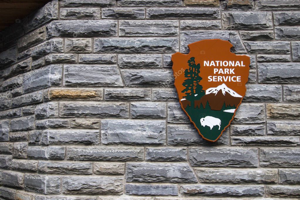Gatlinburg, Tennessee, USA - May 14, 2017: Insignia for the United States National Park Service on a visitors center in the Great Smoky Mountains National Park.