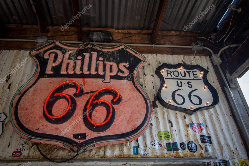 Hackberry, Arizona, USA - February 17, 2020: Close up of retro neon Phillips 66 and Route 66 signs.