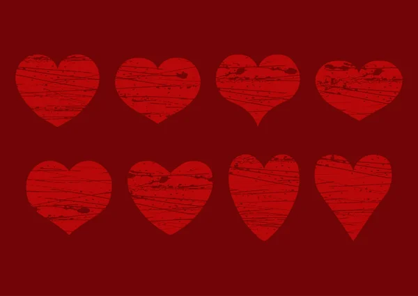 Vector set van geïsoleerde grunge rode harten van verschillende vorm op een kastanjebruine achtergrond. EPS-10. — Stockvector