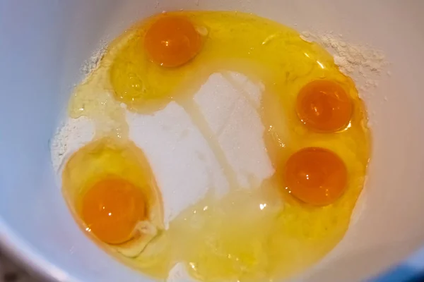 A bowl full of egg flour and sugar — ストック写真