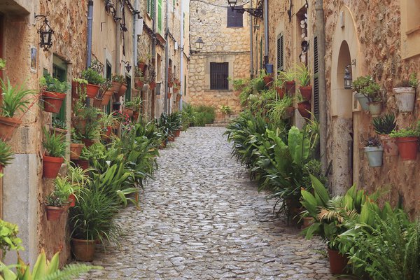 Valldemossa typical village with plants pots in facades at Mallorca island, Spain