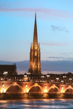 Pont de Pierre bridge with St Michel cathedral, Bordeaux, France clipart