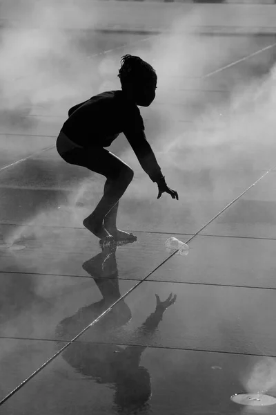 Girl running on Bordeaux water mirror Stock Image