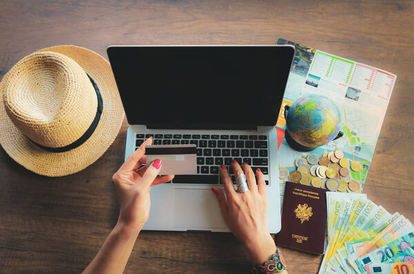 woman's hand holding credit card typing laptop, payment shopping online.