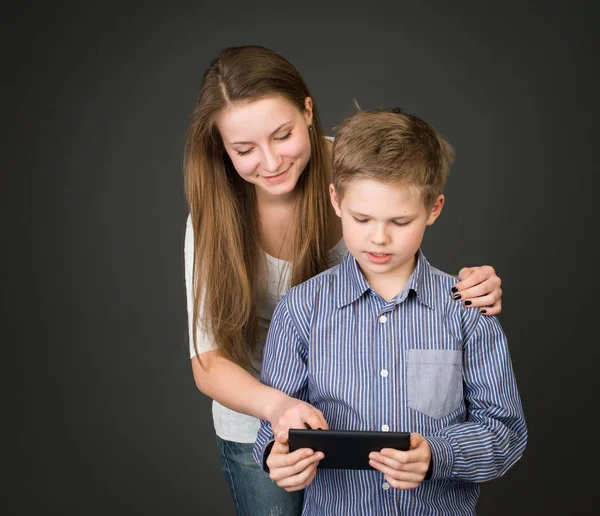 Boy and girl with digital tablet. Interested in technology — Stock Photo, Image