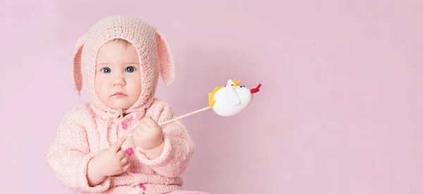 Closeup portrait of cute baby with blue eyes in knitted costume — Stock Photo, Image