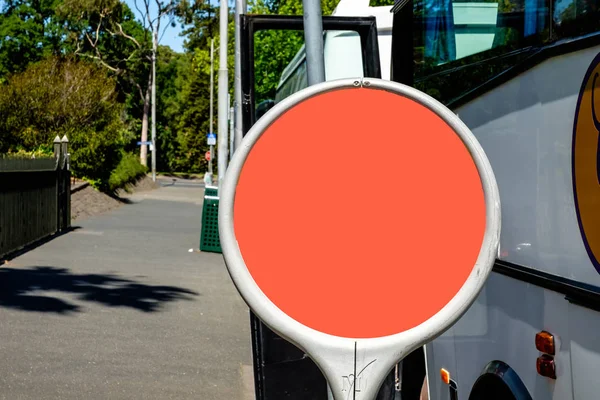 Circular bus stop sign template with orange background on a meta