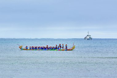 LY SON ISLAND, QUANG NGAI, VIETNAM - JANUARY, 28th 2020: Fishermen participating a boat race in Ly Son island, Quang Ngai, Vietnam on Lunar New Year's occasion 2020