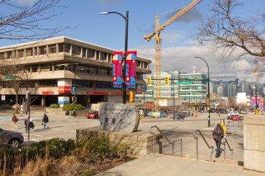 Vancouver, Canada - February 17, 2020: Vancouver 2010 Winter Games Host City monument near Vancouver City Hall at sunny day with View of Cambie street and construction site in the background