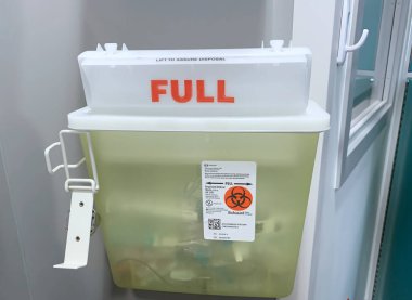 Vancouver, Canada - March 11, 2020: Sharps container for dispose of used injection and inhalation materials that can spread infections on the wall at BC Children's Hospital