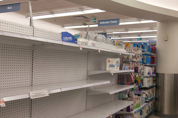 Vancouver, Canada - March 15,2020: Empty Shoppers Drug Mart store shelves show shortage of bathroom tissue as Coronavirus (COVID-19) fears people to buy more supplies