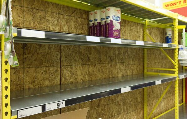 Vancouver, Canada - March 15,2020: Empty No Frills store shelves show shortage of bathroom tissue as Coronavirus (COVID-19) fears people to buy more supplies
