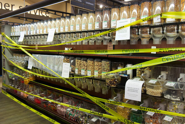 Vancouver, Canada - March 18,2020: Closed Safeway store bulk section due to Coronavirus (COVID-19) with tape "Caution" all over it