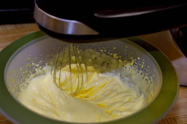 Mixing eggs, flour and sugar for baking a sponge cake. — Stock Photo, Image
