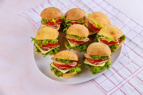 Appetizer small sandwich roll with ham and vegetables. — Stock Photo, Image