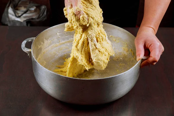 Woman mixing with hand yeast dough for buns. — Stock Photo, Image