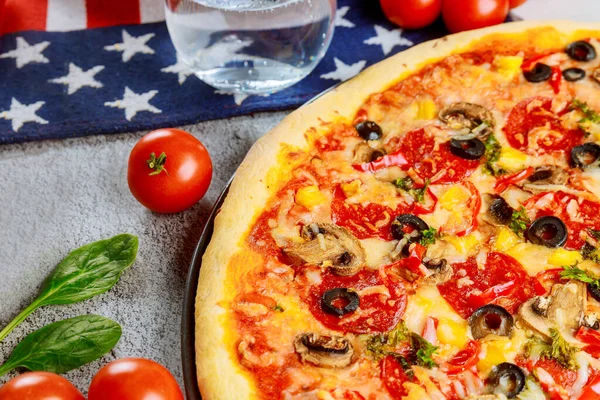 Pizza party for american holiday on wooden table.