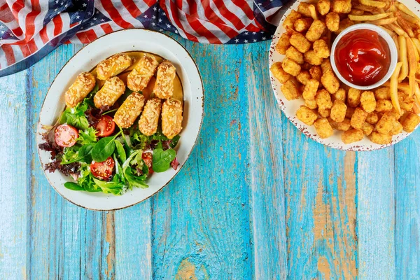 American party table with fried potato, ketchup and vegetable. — ストック写真