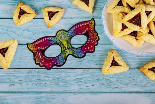 Purim sfondo con maschera e triangolo biscotti . — Foto Stock