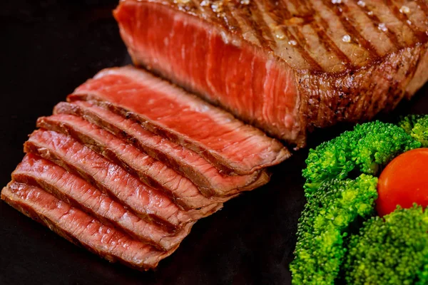 Sliced Rare Beef Tenderloin Broccoli Black Background Wooden Table — Stock Photo, Image