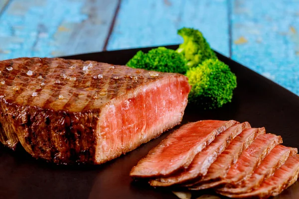 Sliced Rare Beef Tenderloin Broccoli Black Background Wooden Table — Stock Photo, Image
