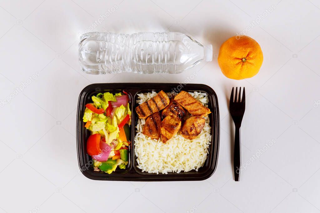 Healthy food delivery or take away lunch in plastic container.