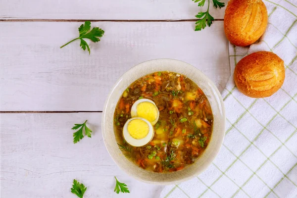 Healty spinach soup with egg and crusty rolls on wooden background. — Stock Image Healty Spinach Soup Egg Crusty Rolls Wooden Background Stock Image