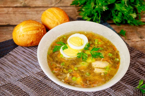 Spinach soup with egg and crusty rolls on wooden background. — Stock Image Spinach Soup Egg Crusty Rolls Wooden Background Royalty Free Stock Images