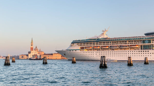 VENICE, ITALY-OCTOBER 29, 2016: Big cruise ship with tourists leaving the city of Venice Italy
  