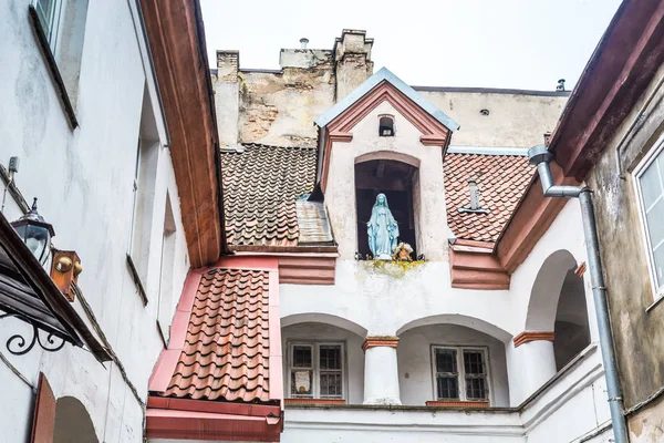 Small courtyard with a sculpture of Maria old town Vilnius Lith