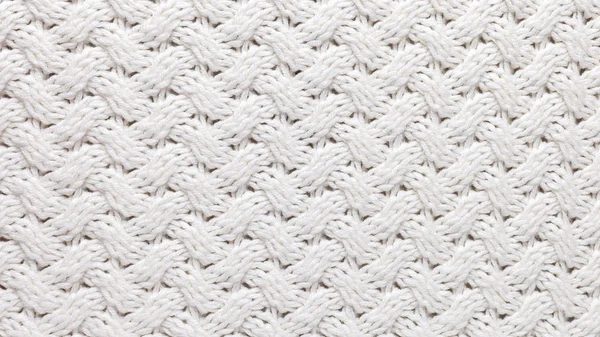 white knitted texture background. Warm winter clothes