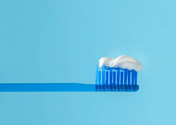 Toothbrush Paste Blue Back Closeup — Stock Photo, Image