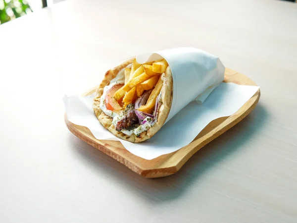 close-up view of delicious greek dish Gyros in restaurant