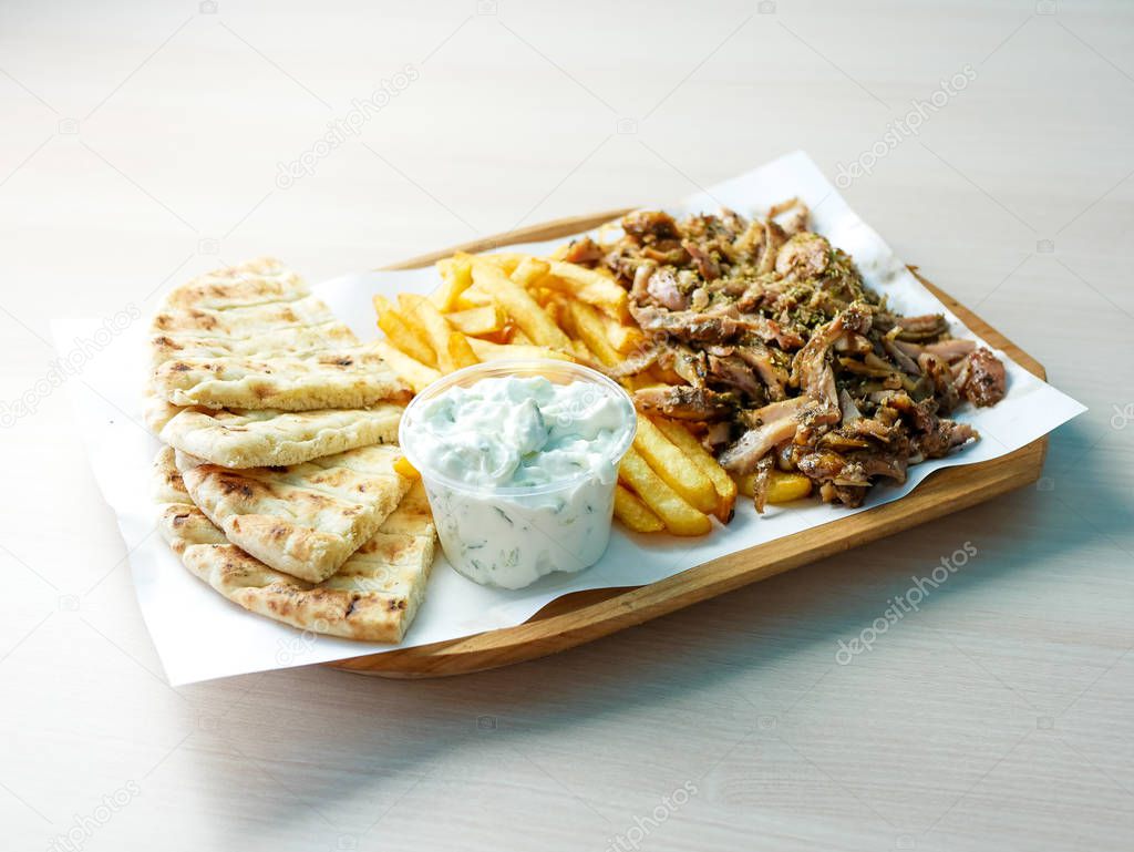 close-up view of delicious greek dish Gyros in restaurant 