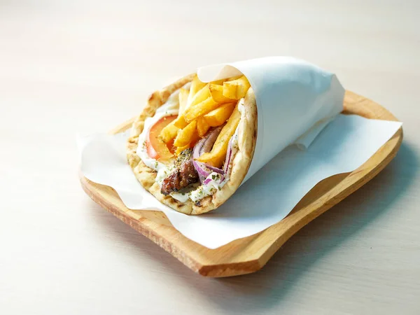 close-up view of delicious greek dish Gyros in restaurant
