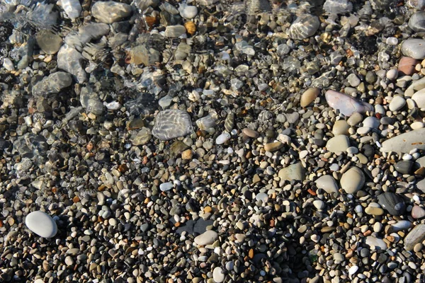 Felsen Und Kieselsteine Auf Dem Grund Die Von Einer Welle — Stockfoto