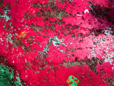 Eski boyanmış granit kaya arka planı. Kırmızı, gri, kahverengi