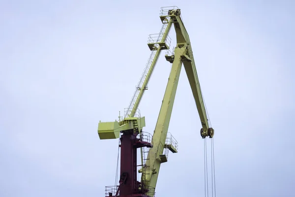 Big shipping dock cranes located in small baltic sea port. — 스톡 사진