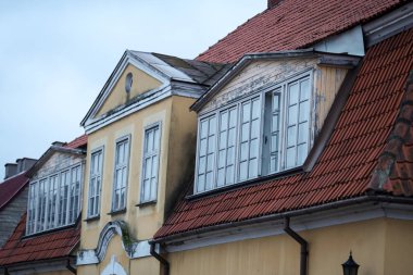 Old house with big wood windows.