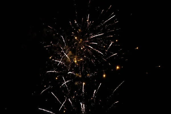 Beautiful new years firework celebration in black evening sky. — Stock Photo, Image